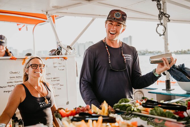 Sun & Sightseeing Hakuna Matata Catamaran Cruise in Palm Beach - Drinks, snacks, music, and the onboard mood