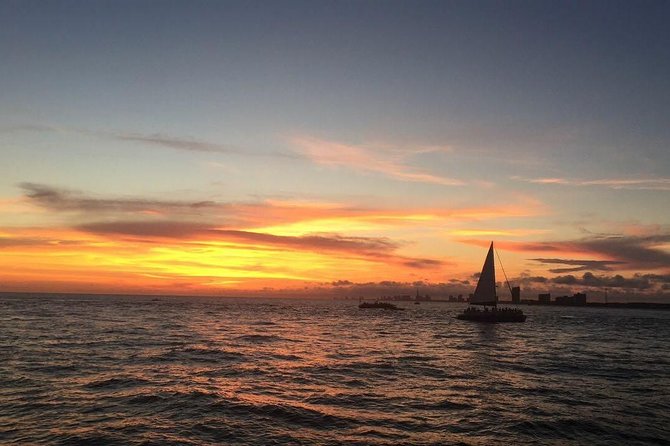 Sunset Dolphin Sail Aboard the Footloose Catamaran - Music, drinks, and the onboard mood