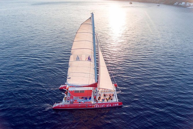Sunset Sailing Catamaran Cruise in Santorini with BBQ and Drinks - White Beach, swimming, and the onboard BBQ