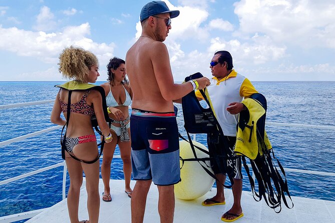 Tour to Cozumel by Catamaran with Snorkeling and Buffet Lunch - 7:30 or 9:30? Confirm the morning meeting time