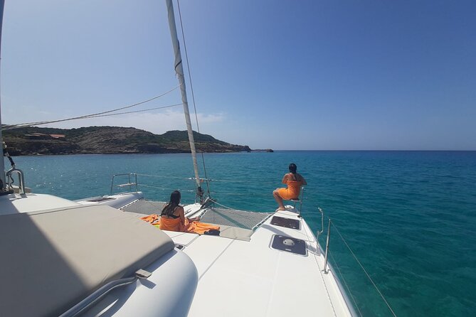 unique aperitif experience at sunset on a catamaran - Leaving Alghero’s port on a 13-meter catamaran