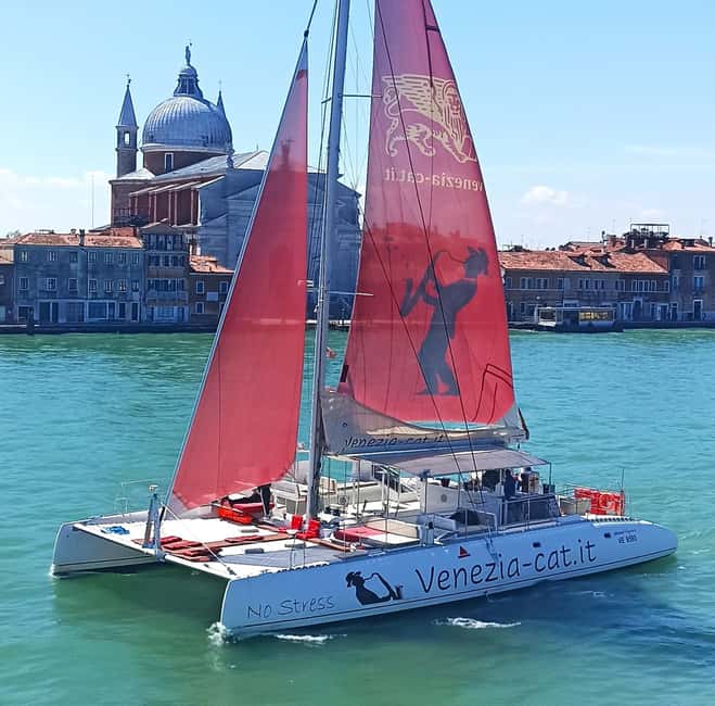 Venice: Lagoon Catamaran Tour with Classical Music & Drinks - Along the Giudecca Canal