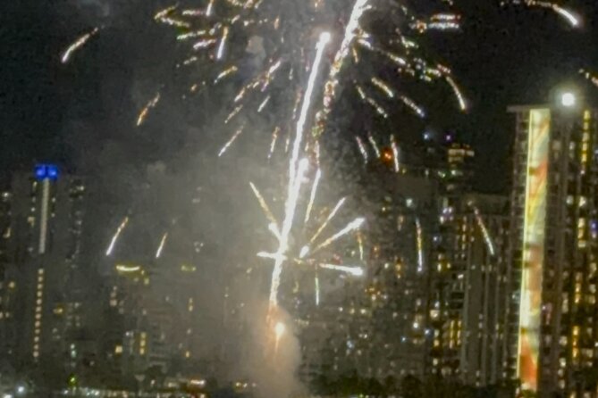 Waikiki Beach Catamaran Friday Night Fireworks Tour - Watching the Hilton Hawaiian Village fireworks from offshore